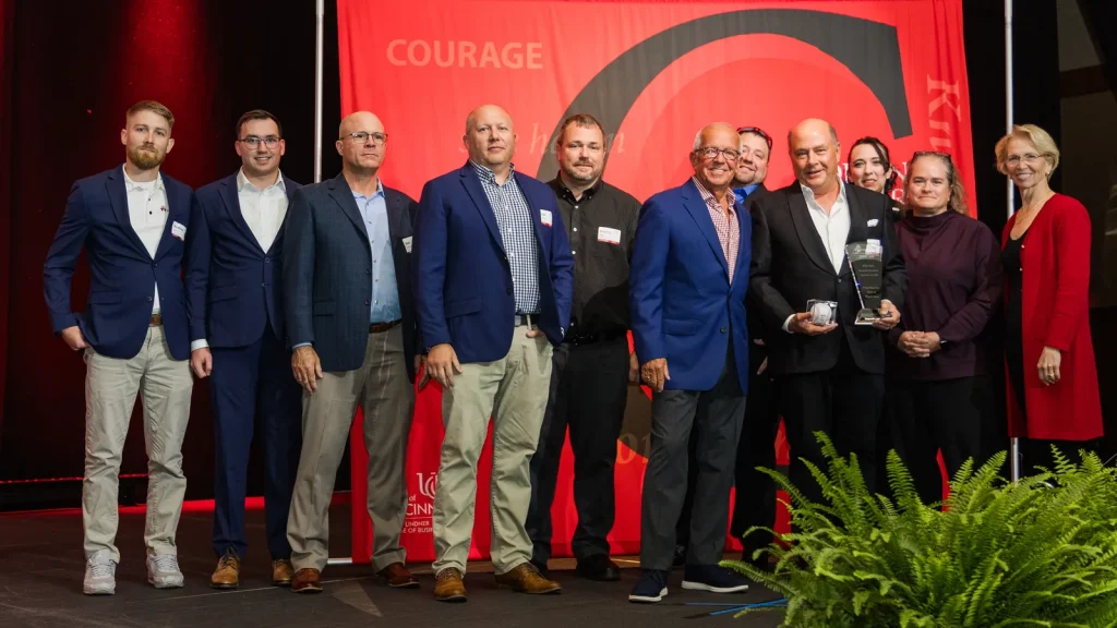 The WSA USA team on stage at the 2026 Family and Private Business Awards, holding the honoree award in front of the event banner.